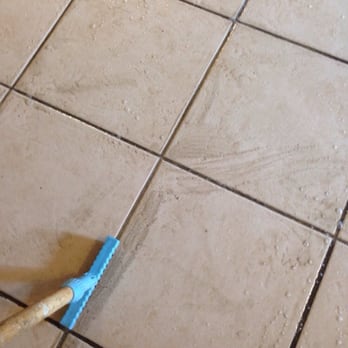 Grout Being Cleaned With A Brush