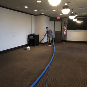Man Cleaning The Carpet